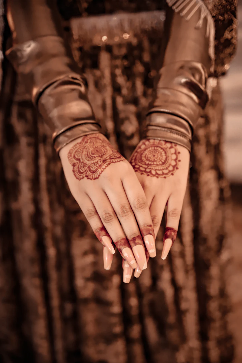 A woman’s hands decorated with henna